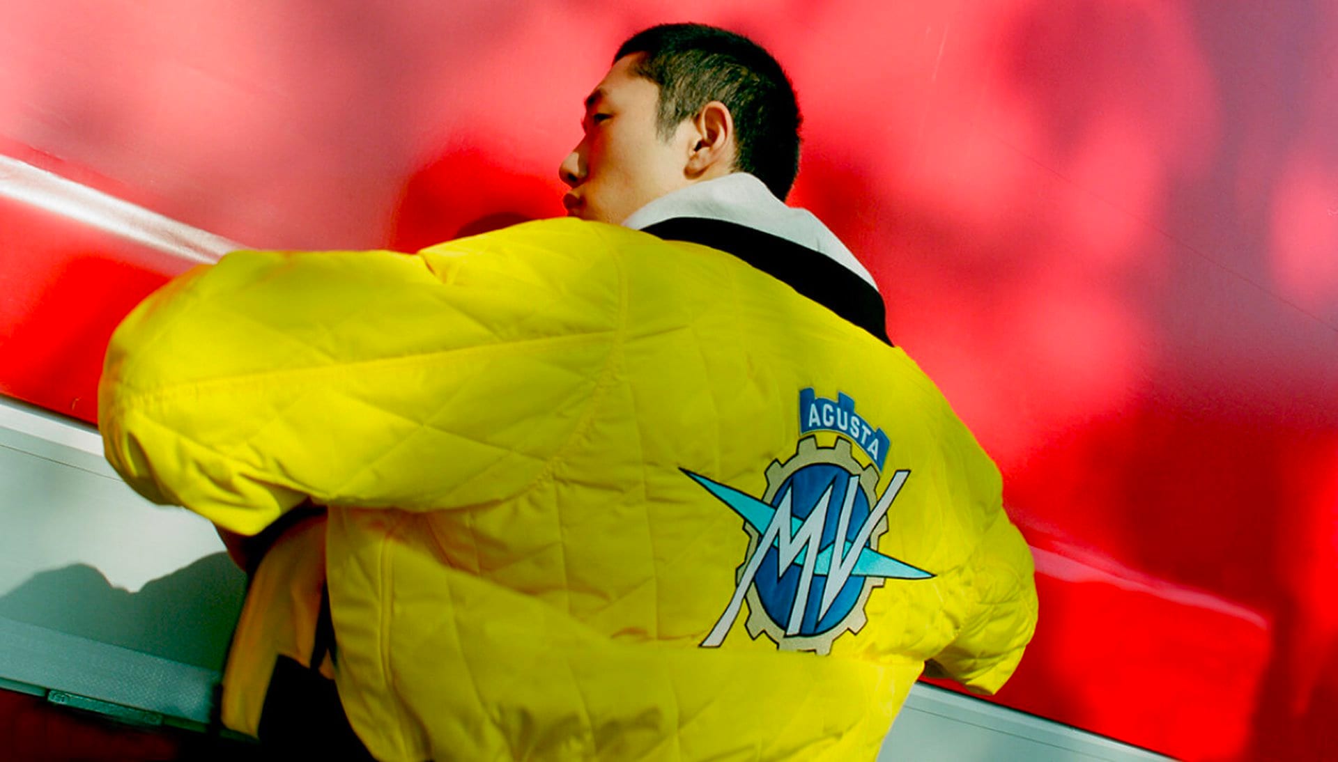 Model wearing the yellow MV Agusta Logo Level 2 quilted jacket
